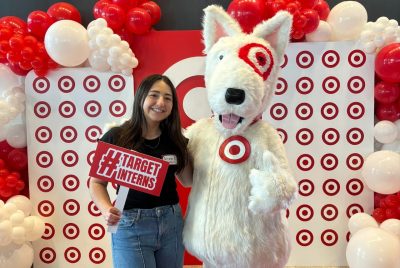 Juliana Iacono poses with the Target mascot, a furry dog