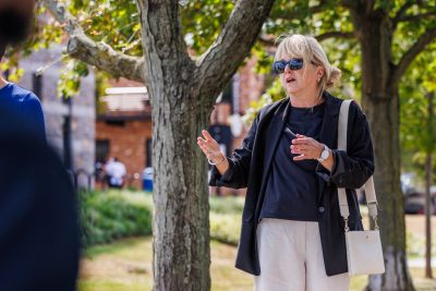 Christine Kelley talks with students during a class walk outside in Alexandria. Craig Newsome photo for Virginia Tech.